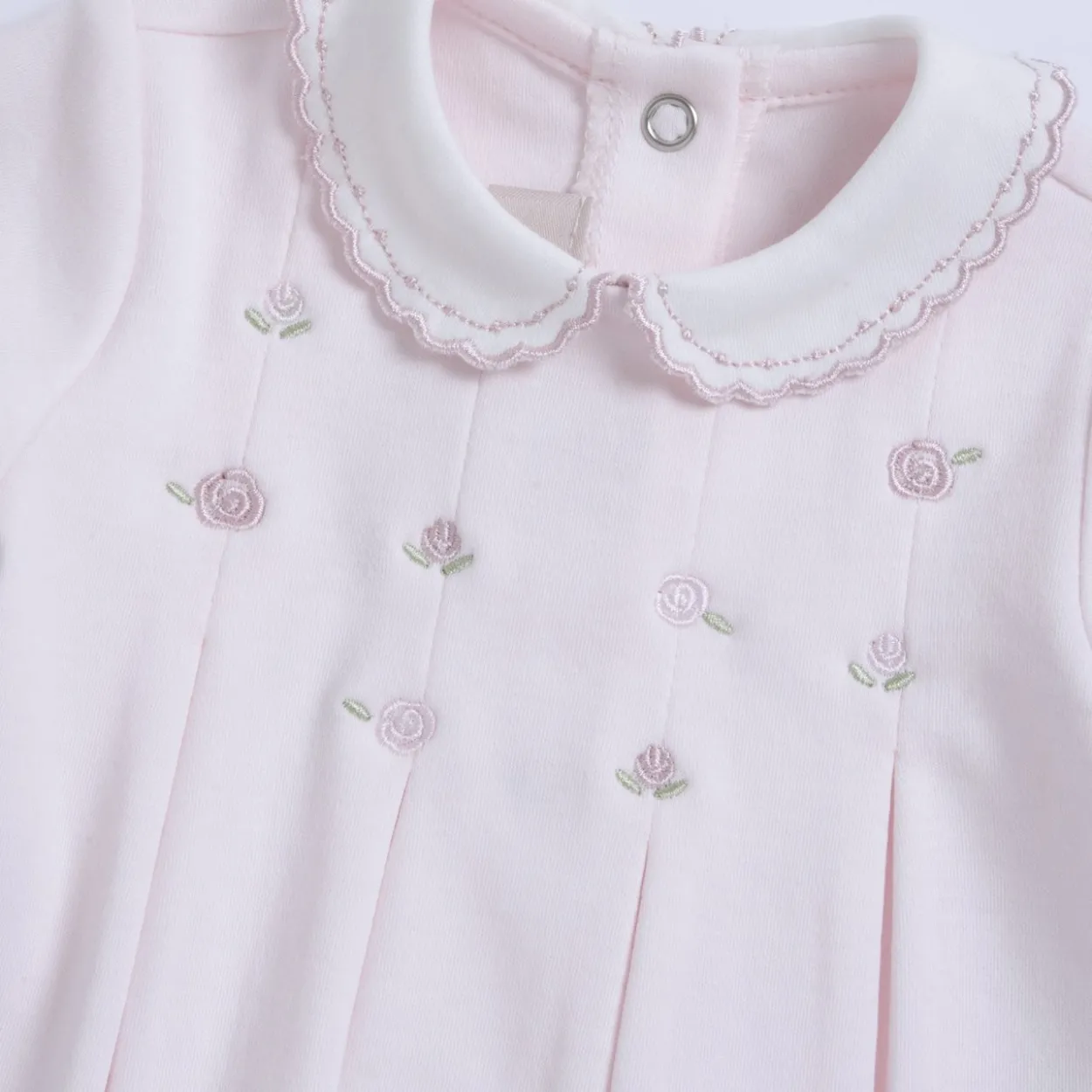 Completo maglia e pantaloni con piedini